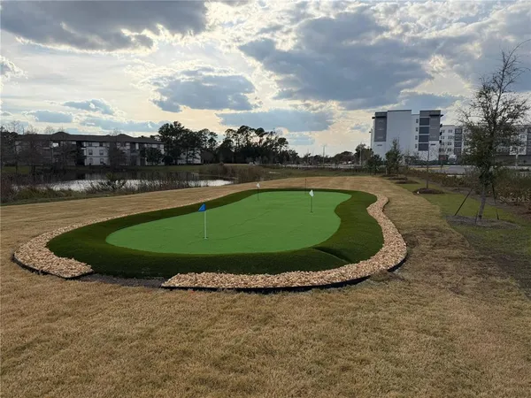 a view of a swimming pool with a yard