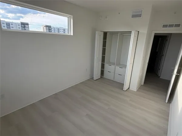 a view of a hallway with closet area