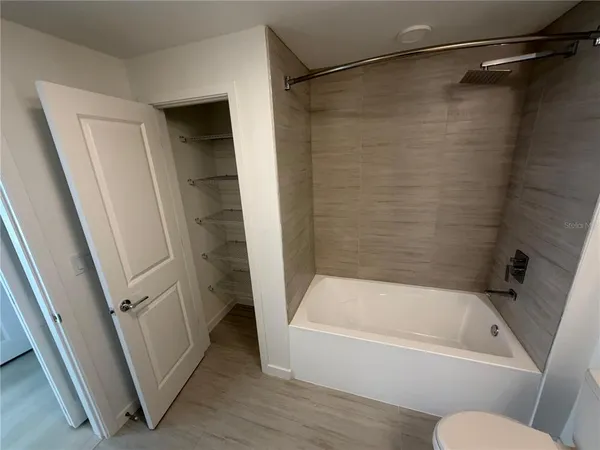 a bathroom with a bathtub and a shower