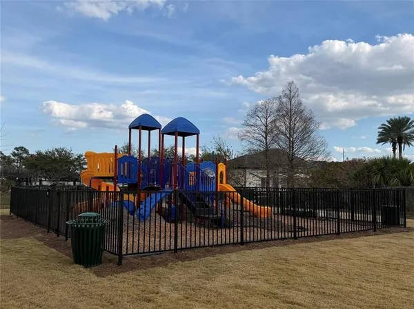 a view of a house with iron fence