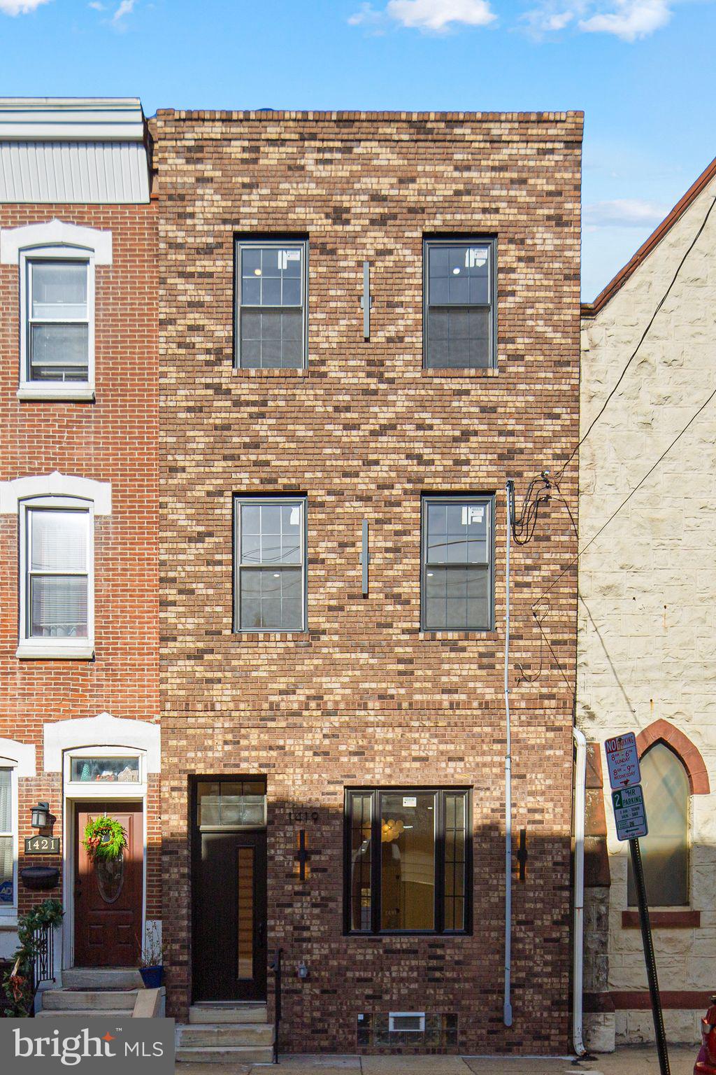 1419 Wharton Street Philadelphia, PA 19146 - Photo 33 of 39 a view of a brick house with large windows