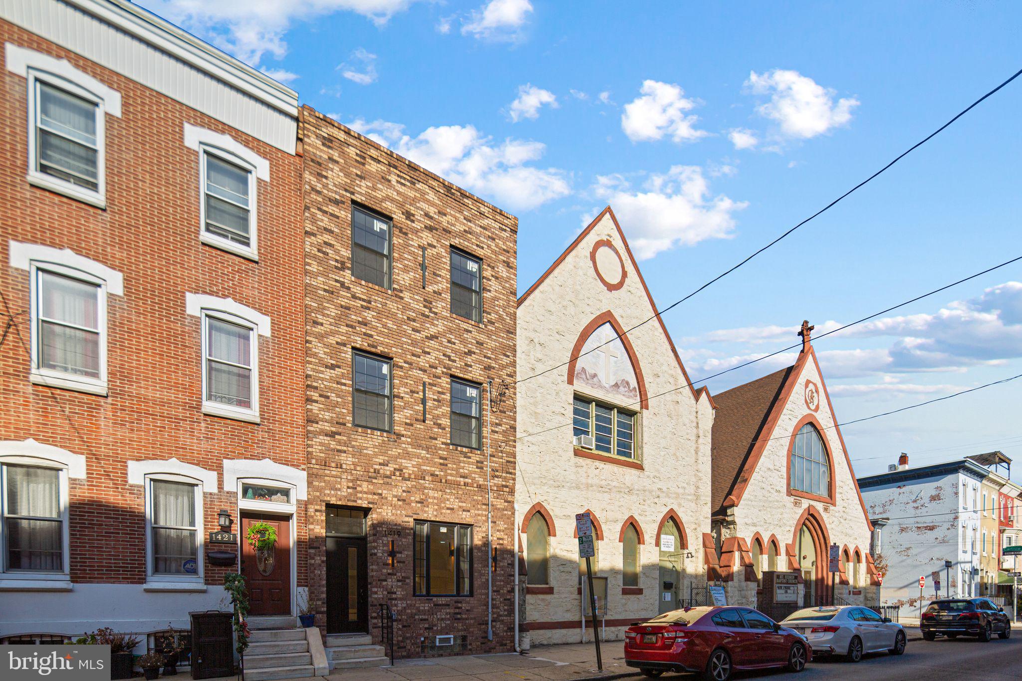 1419 Wharton Street Philadelphia, PA 19146 - Photo 35 of 39 a view of a building with car parked