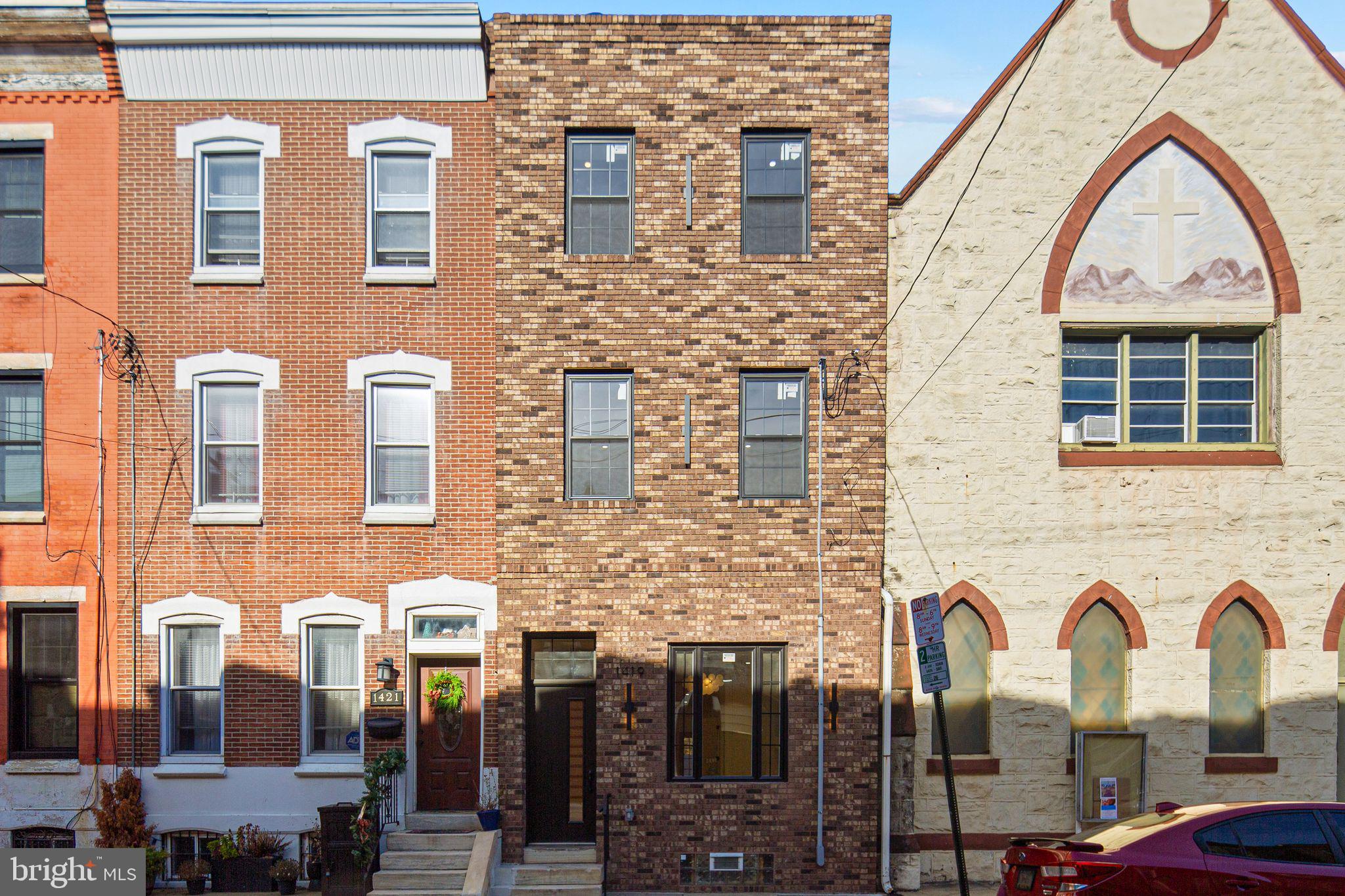 1419 Wharton Street Philadelphia, PA 19146 - Photo 36 of 39 a view of a brick house with many windows