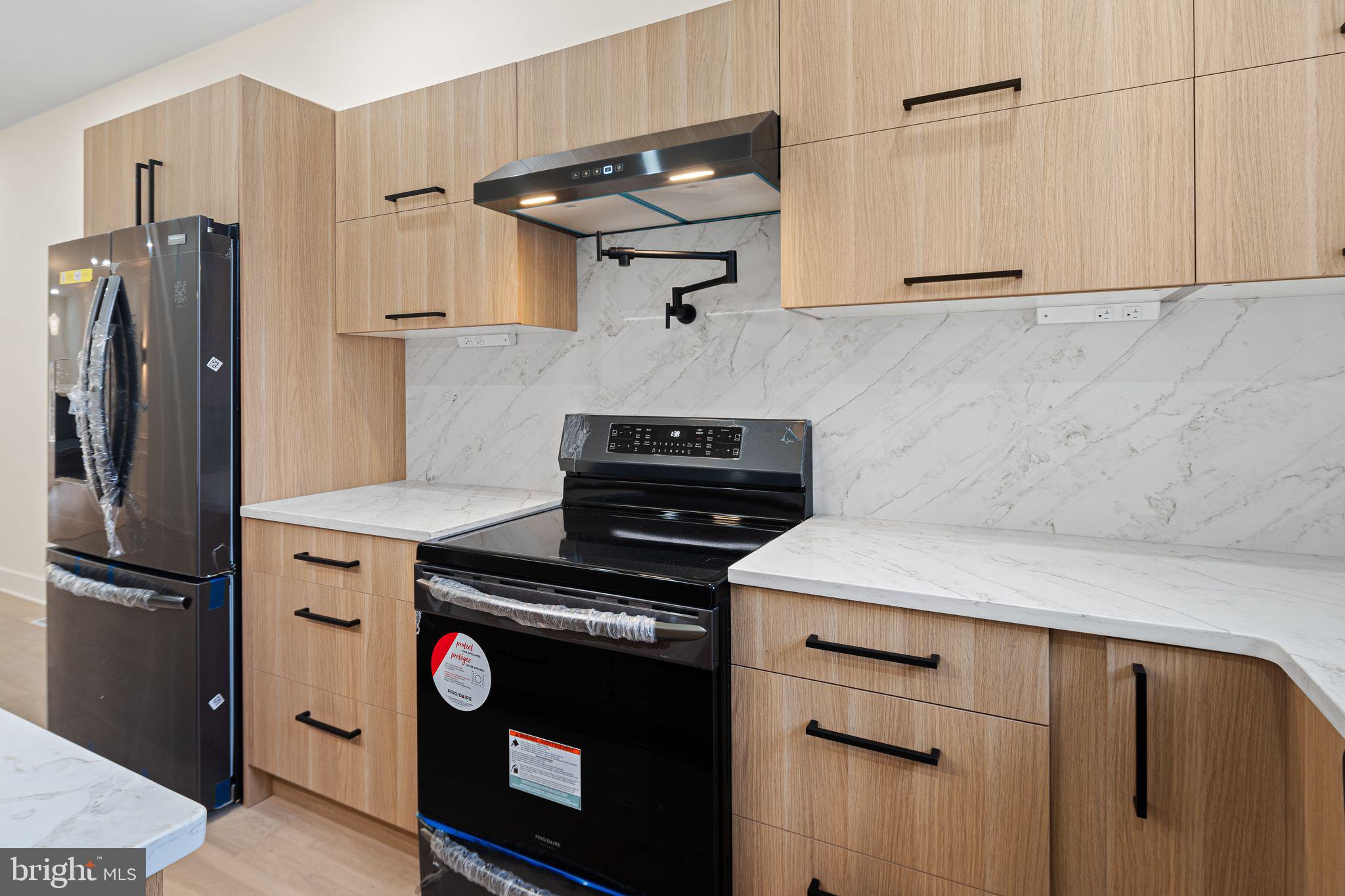1419 Wharton Street Philadelphia, PA 19146 - Photo 6 of 39 a kitchen with appliances cabinets and a counter top space