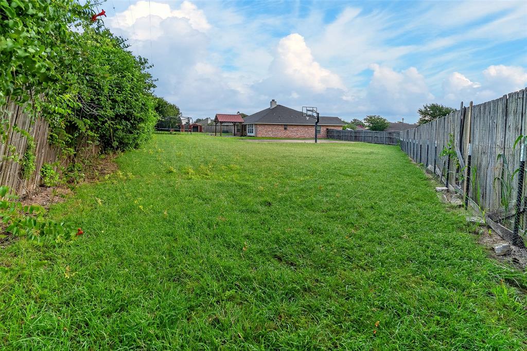 124 Topaz Circle Hewitt, TX 76643 - Photo 34 of 35 Expansive fenced backyard featuring a substantial grassy area