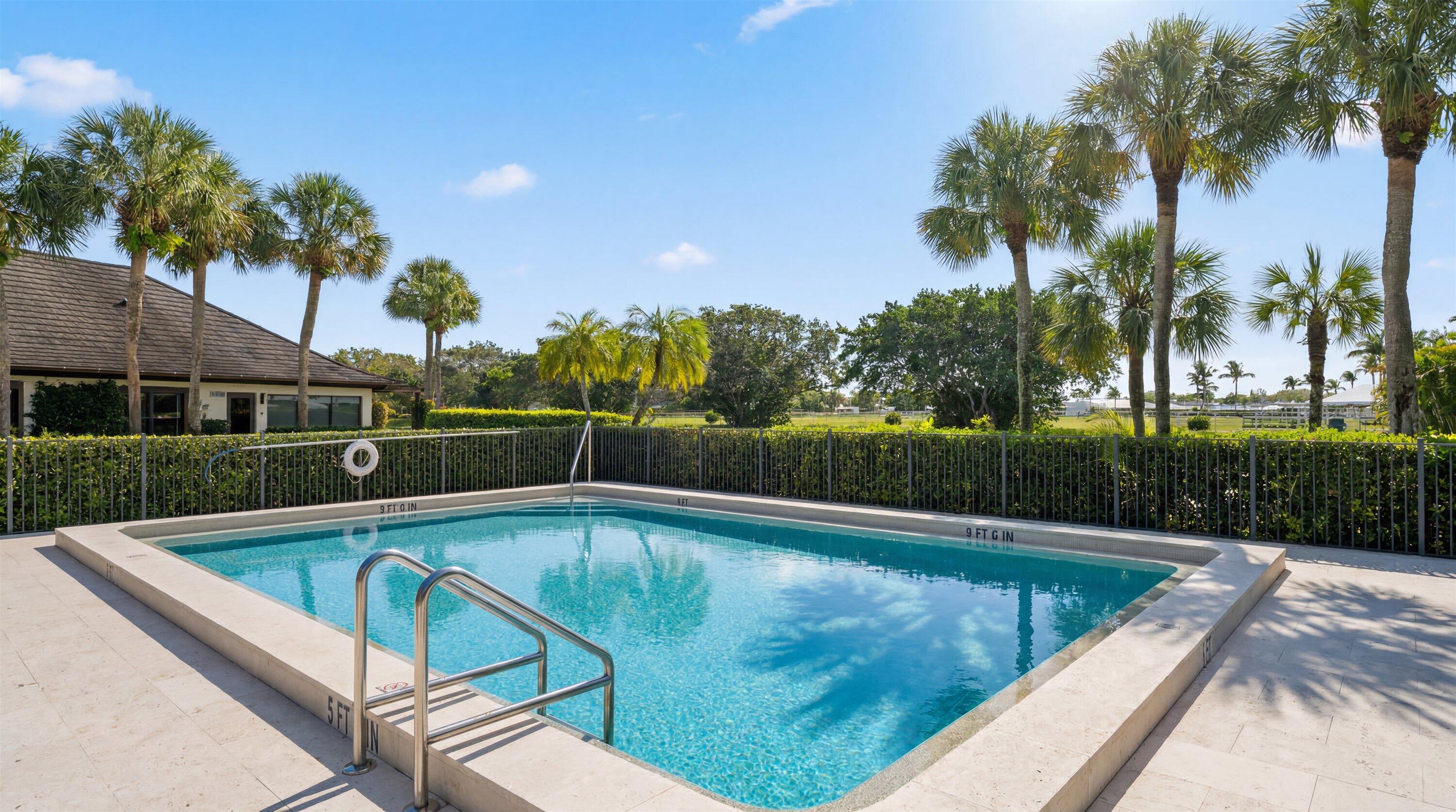 13400 Polo Road West, Unit 203 Wellington, FL 33414 - Photo 24 of 26 a view of a swimming pool with a patio