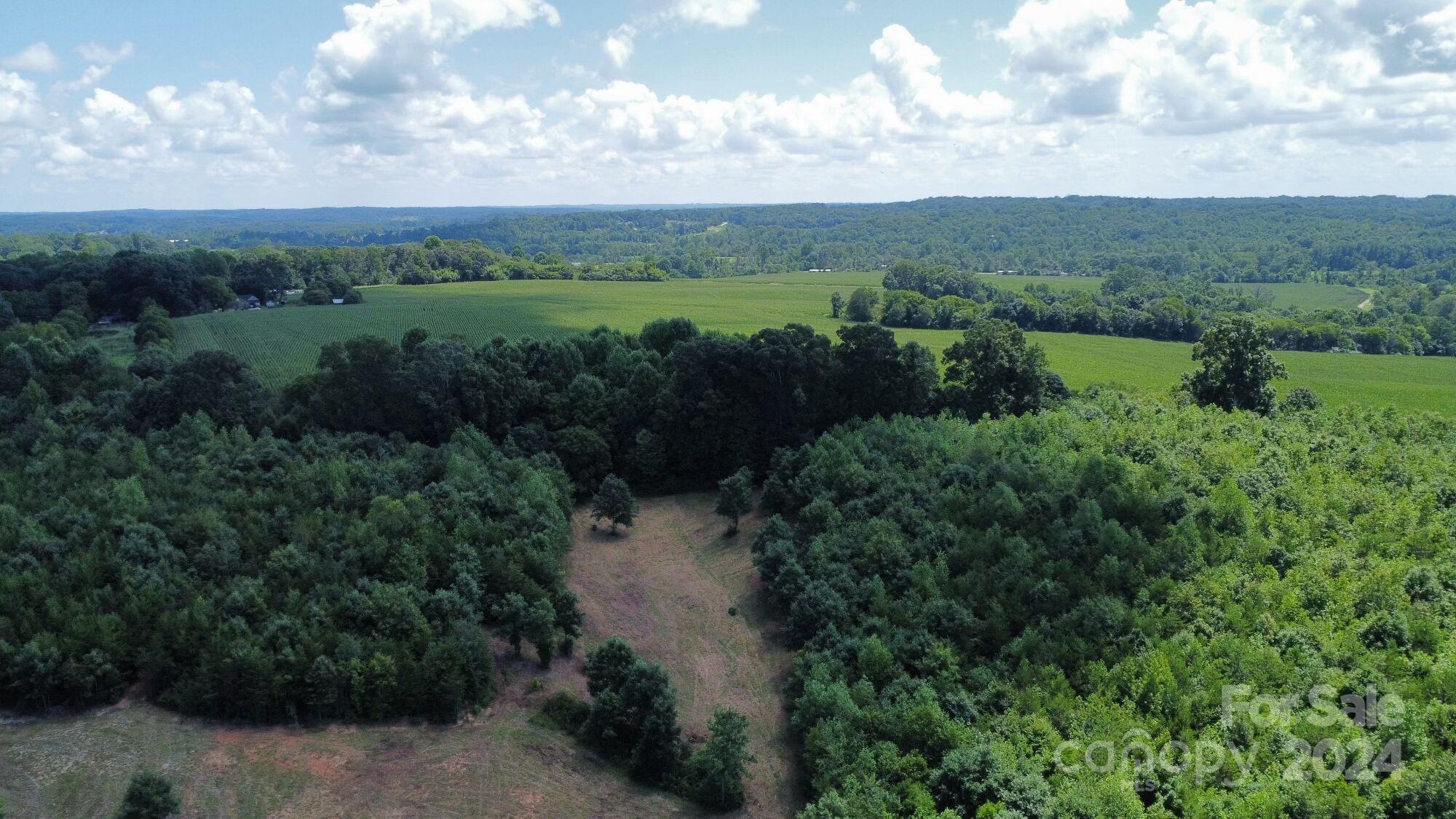 Tbd JB Road, Unit 1 Claremont, NC 28610 - Photo 15 of 31 a view of a lake with green field