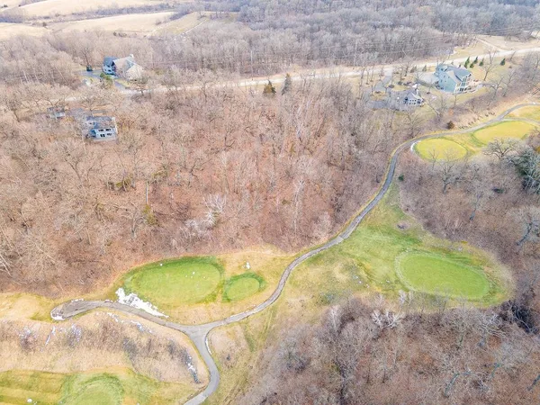 a backyard of a house with lots of trees