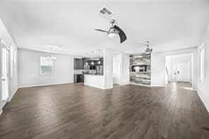a view of a kitchen with a sink and a large window