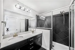 a view of an empty room with a kitchen