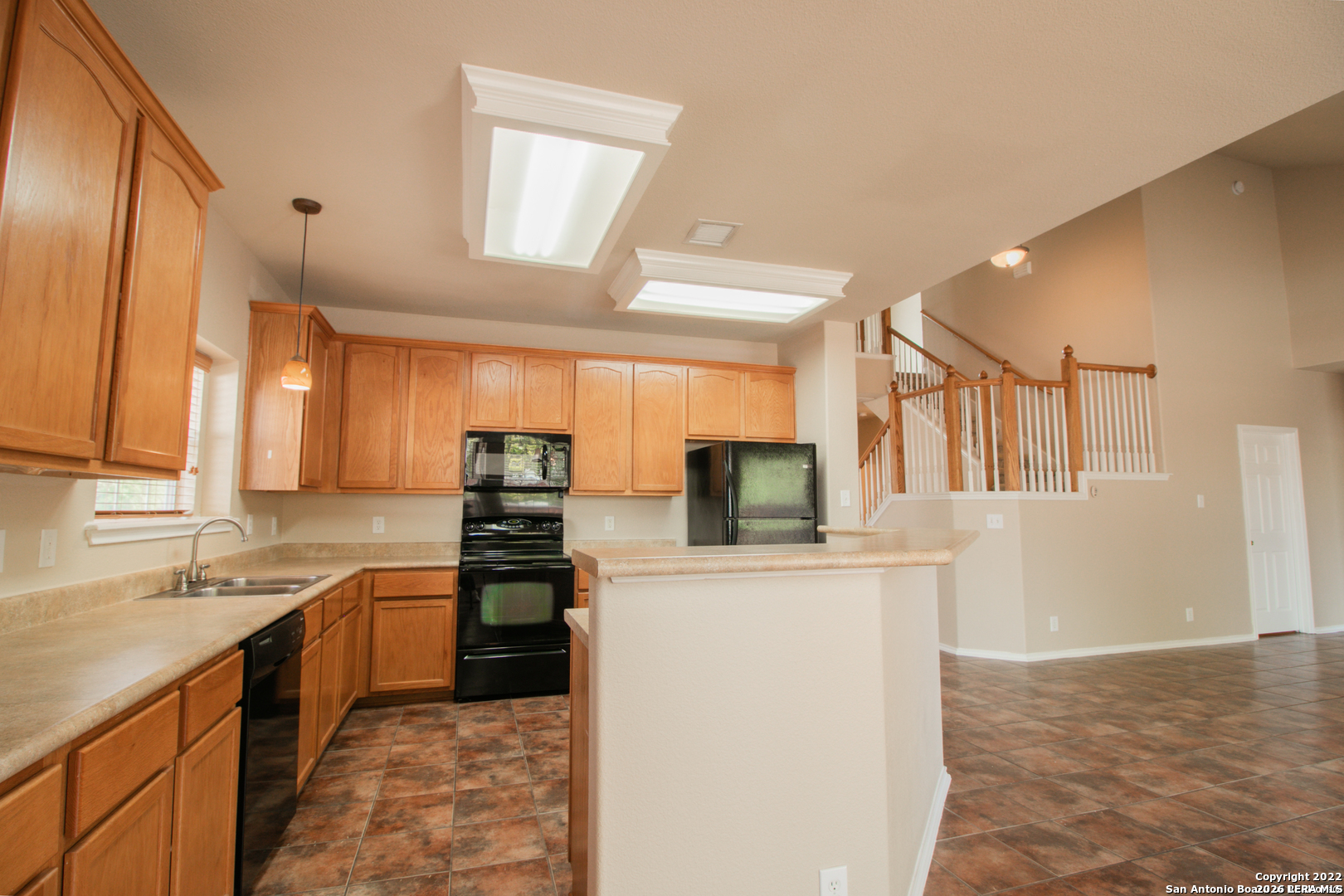 2621 Pillory Pointe Schertz, TX 78108 - Photo 11 of 25 a kitchen with granite countertop a refrigerator stove top oven and sink