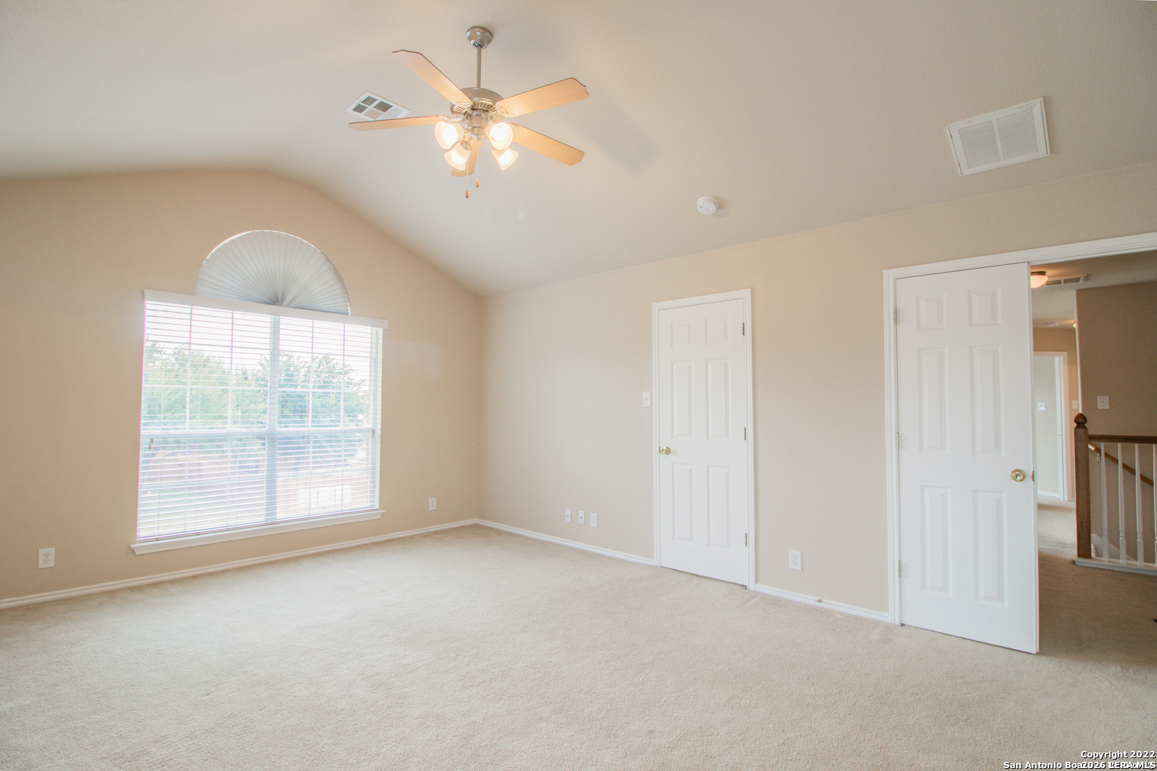2621 Pillory Pointe Schertz, TX 78108 - Photo 13 of 25 an empty room with chandelier fan and windows