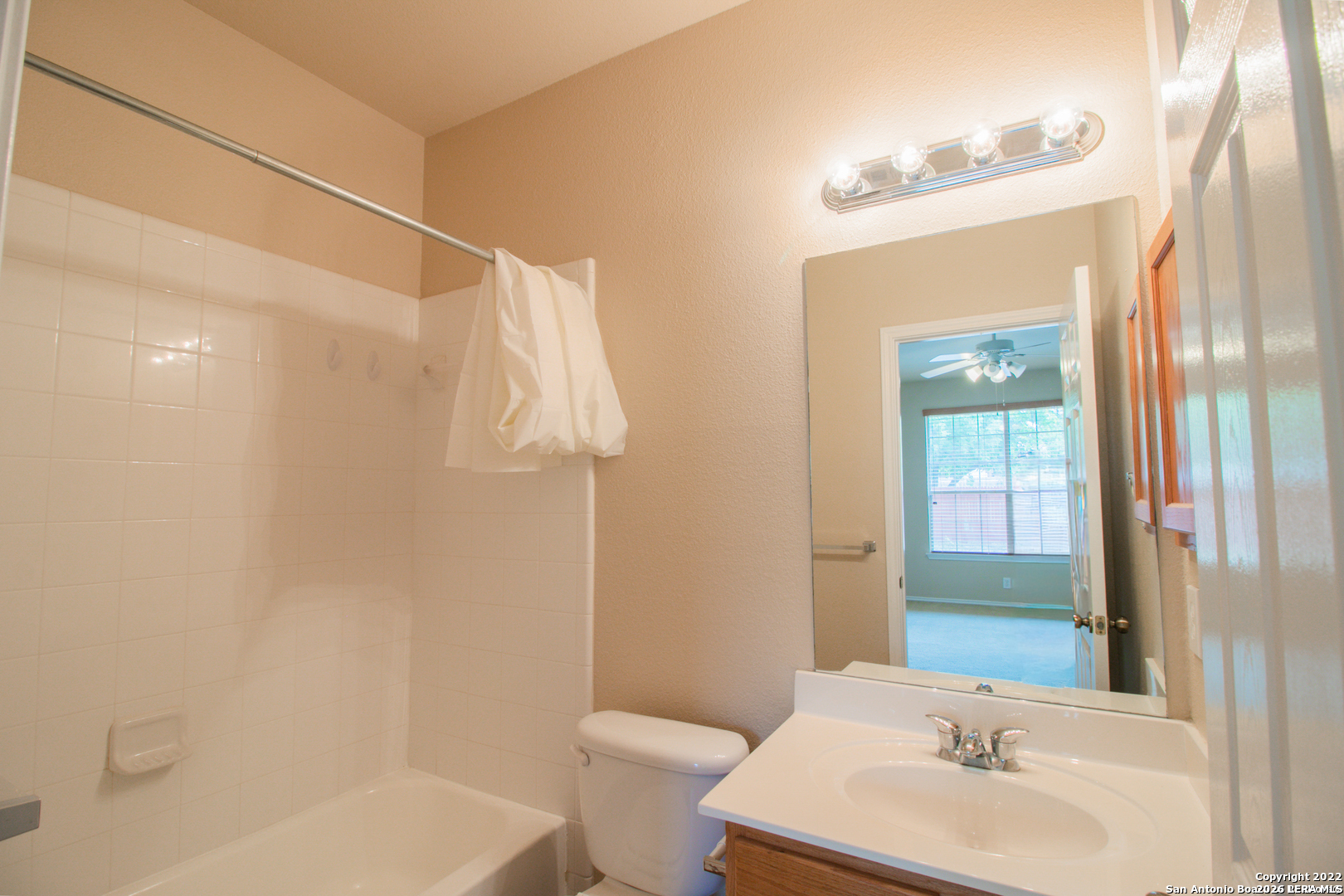 2621 Pillory Pointe Schertz, TX 78108 - Photo 19 of 25 a bathroom with a sink a toilet and shower