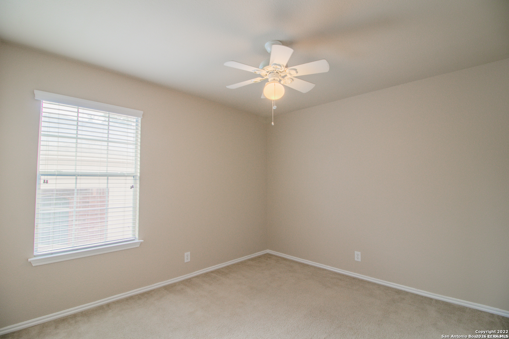 2621 Pillory Pointe Schertz, TX 78108 - Photo 20 of 25 an empty room with a window and a fan