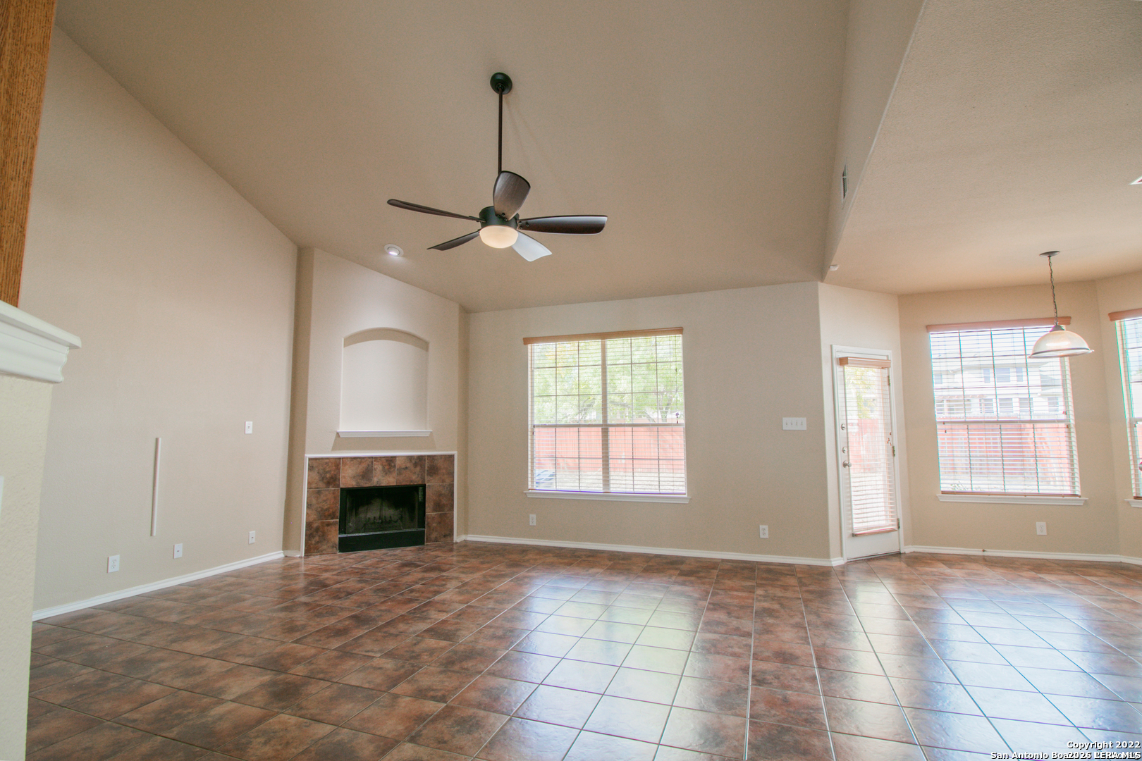 2621 Pillory Pointe Schertz, TX 78108 - Photo 7 of 25 a view of an empty room with window and fireplace