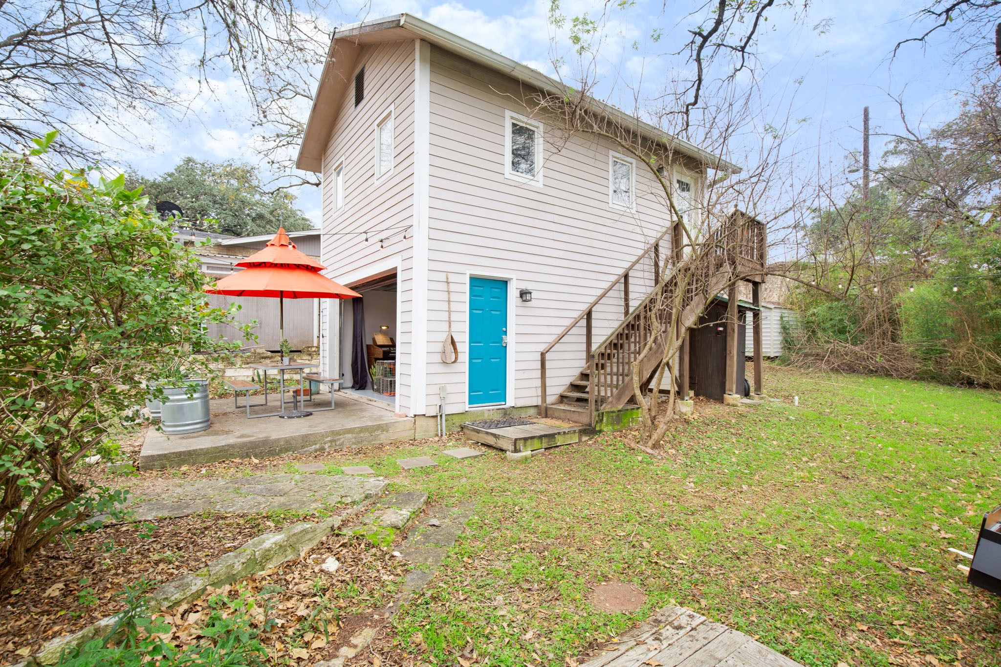 1406 Summit Street Austin, TX 78741 - Photo 26 of 32 a view of a house with a yard and sitting area