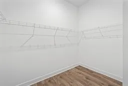 a view of work space with wooden floor and furniture