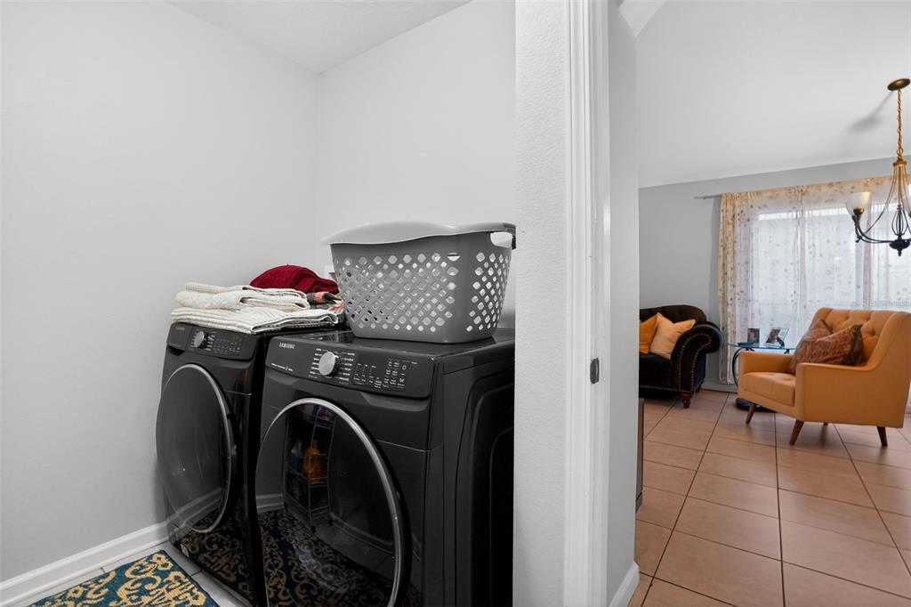11519 Misty Isle Lane Riverview, FL 33579 - Photo 22 of 27 a utility room with dryer and washer