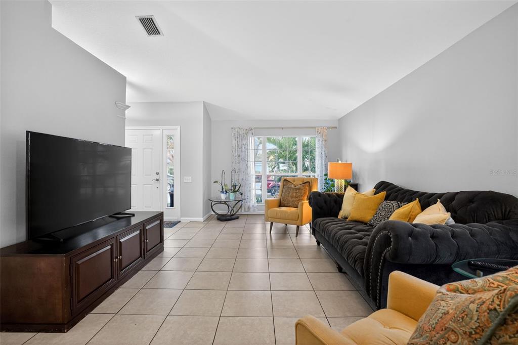 11519 Misty Isle Lane Riverview, FL 33579 - Photo 3 of 27 a living room with furniture and a flat screen tv