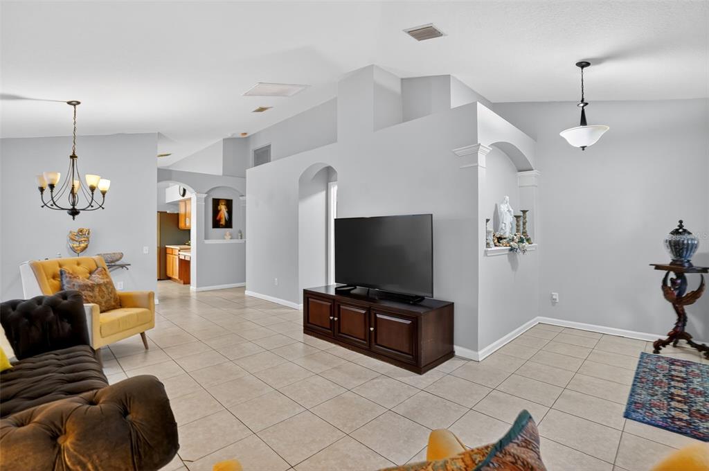 11519 Misty Isle Lane Riverview, FL 33579 - Photo 4 of 27 a living room with furniture and a flat screen tv