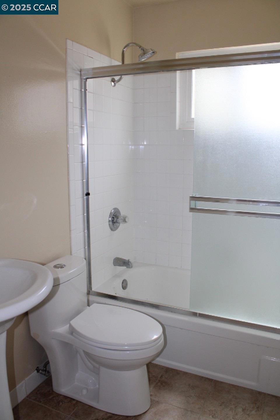 2292 Orleans Drive Pinole, CA 94564 - Photo 14 of 16 a bathroom with a toilet and a shower