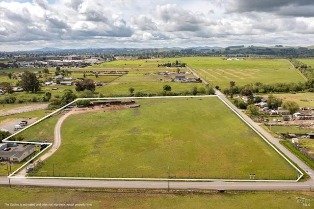 a view of a swimming pool and an outdoor seating