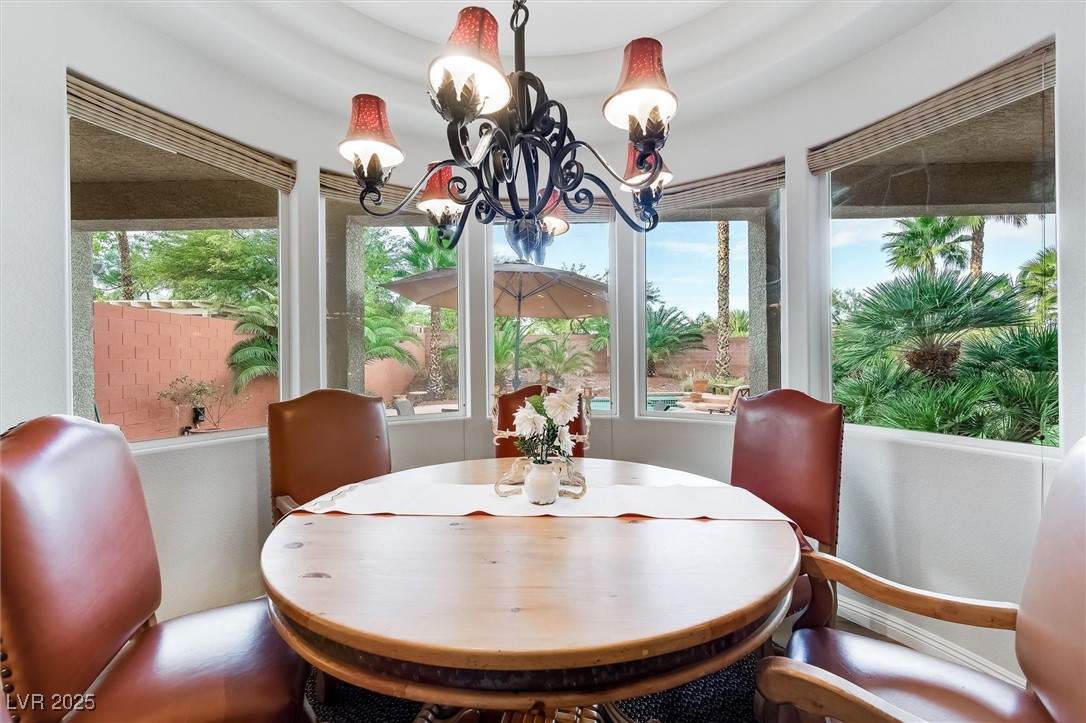 10720 Elm Ridge Avenue Las Vegas, NV 89144 - Photo 20 of 67 Dining room featuring a chandelier