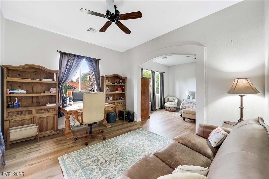 10720 Elm Ridge Avenue Las Vegas, NV 89144 - Photo 25 of 67 Office area featuring a ceiling fan, light wood-type flooring, and arched walkways