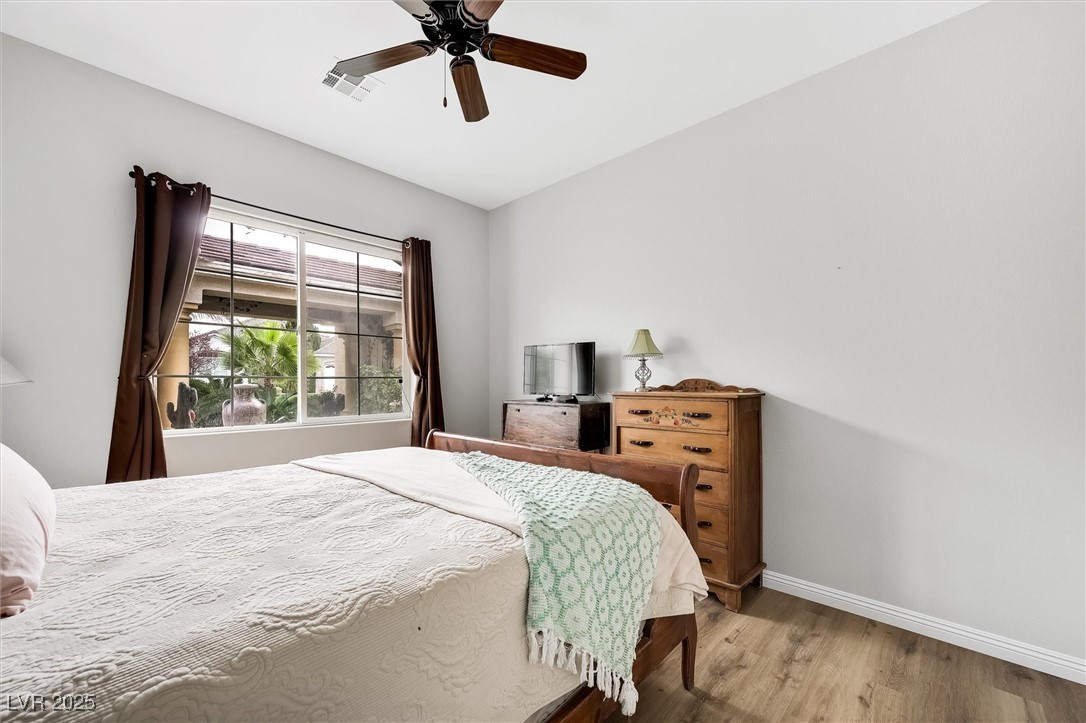 10720 Elm Ridge Avenue Las Vegas, NV 89144 - Photo 39 of 67 Bedroom with wood finished floors and ceiling fan