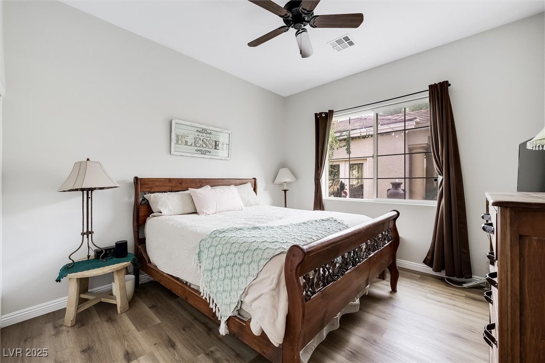 10720 Elm Ridge Avenue Las Vegas, NV 89144 - Photo 40 of 67 Bedroom with wood finished floors and ceiling fan