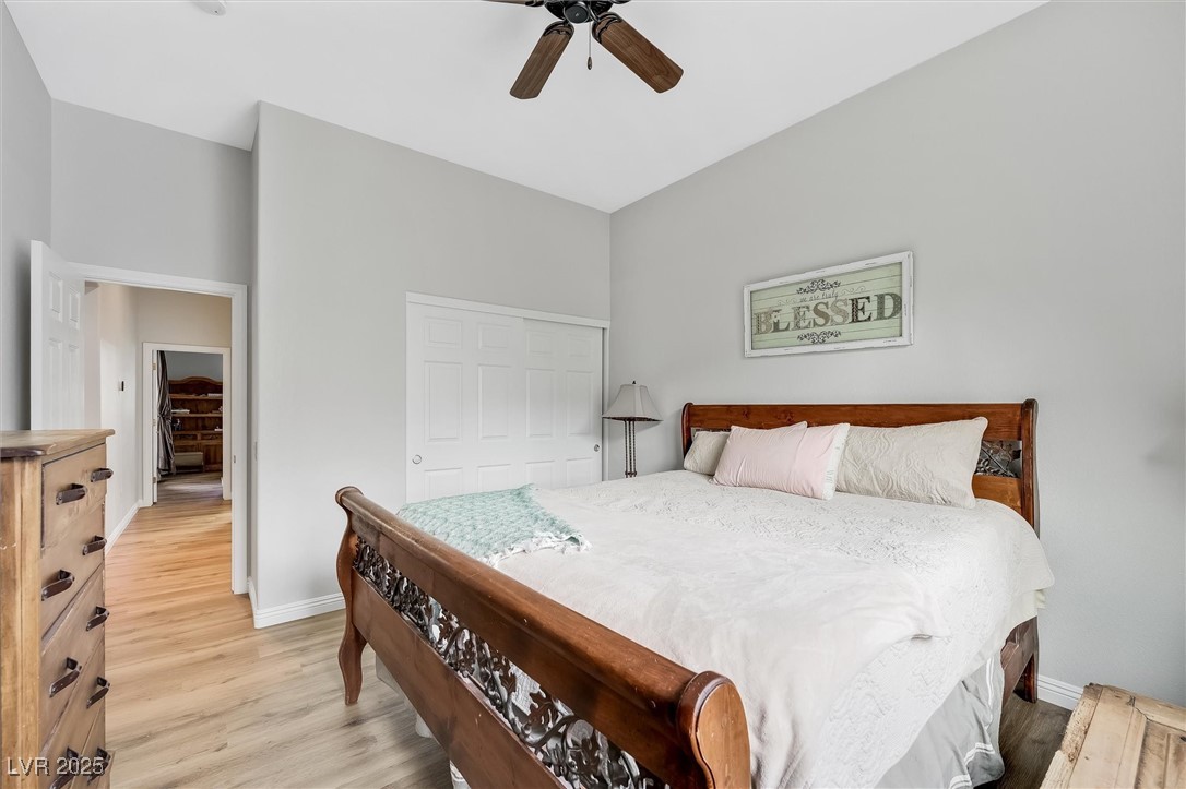 10720 Elm Ridge Avenue Las Vegas, NV 89144 - Photo 41 of 67 Bedroom with light wood-style flooring, a closet, and a ceiling fan
