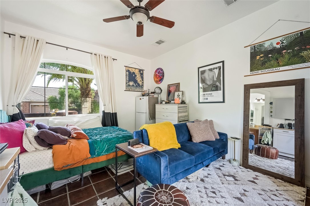 10720 Elm Ridge Avenue Las Vegas, NV 89144 - Photo 44 of 67 Tiled bedroom featuring ceiling fan
