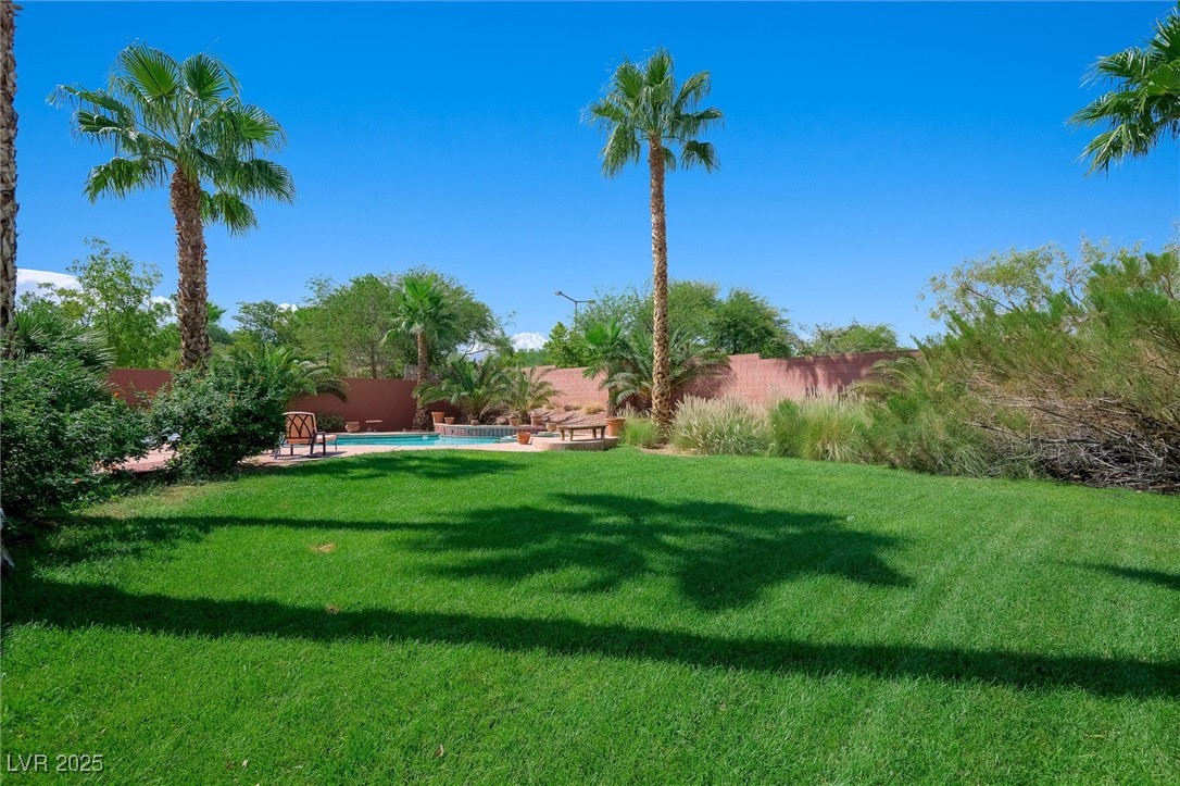 10720 Elm Ridge Avenue Las Vegas, NV 89144 - Photo 53 of 67 Fenced backyard with a patio