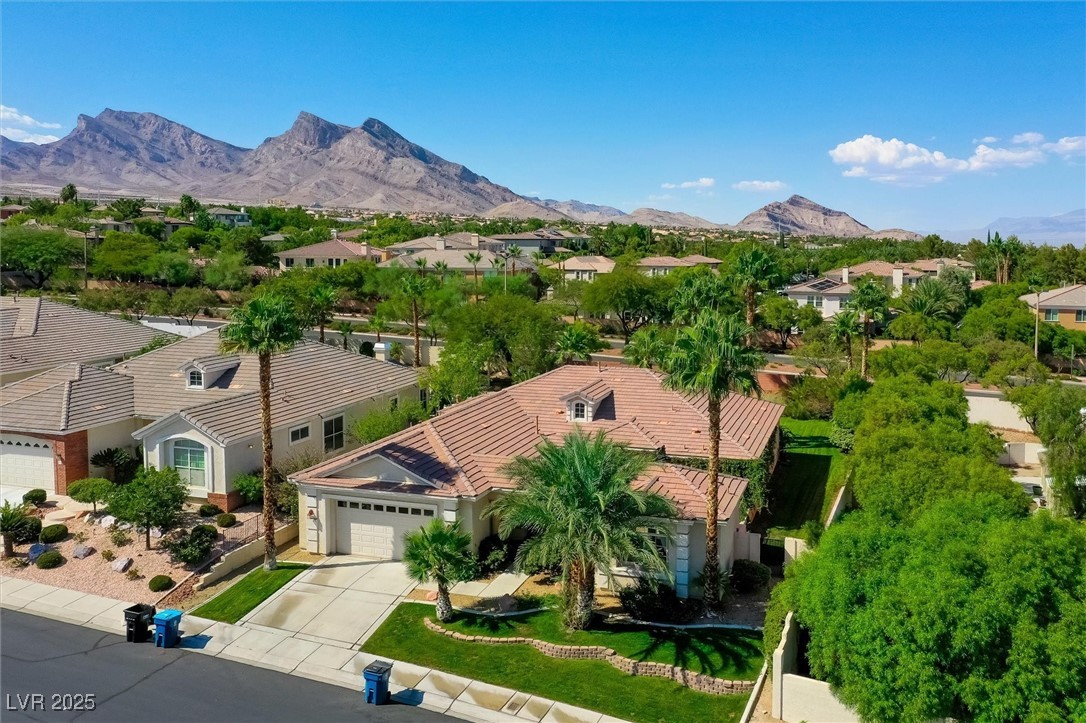 10720 Elm Ridge Avenue Las Vegas, NV 89144 - Photo 55 of 67 Aerial perspective of suburban area featuring a mountainous background