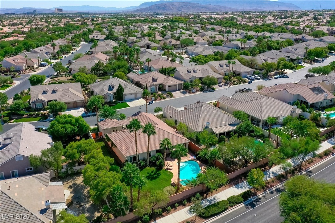 10720 Elm Ridge Avenue Las Vegas, NV 89144 - Photo 58 of 67 Aerial view of residential area featuring a mountain backdrop