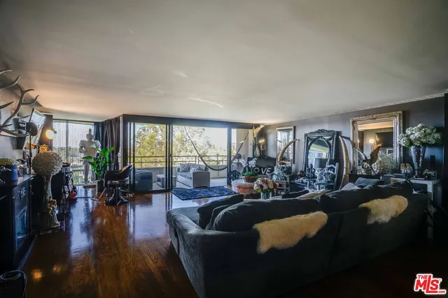 a bathroom with a sink vanity mirror and toilet