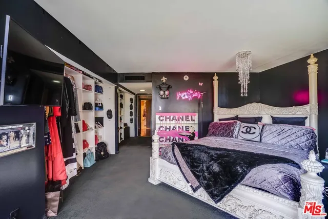 a building exterior with furniture and garden