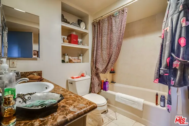 a view of a swimming pool with outdoor seating