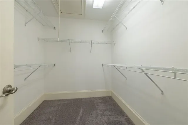 a bathroom with a granite countertop bathtub sink and mirror