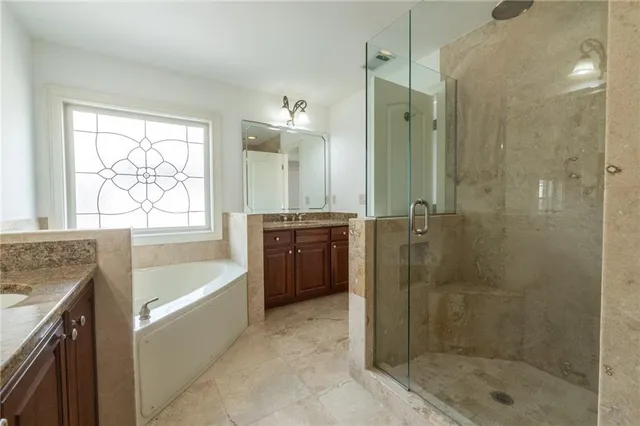 a view of a balcony with wooden floor and fence