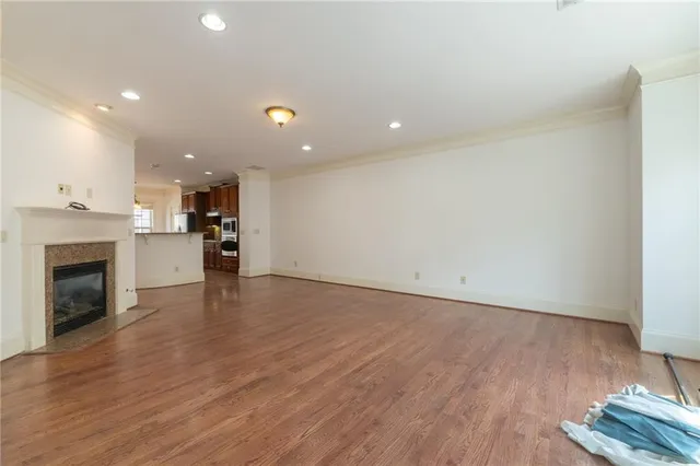 a view of a kitchen with a sink and a fireplace