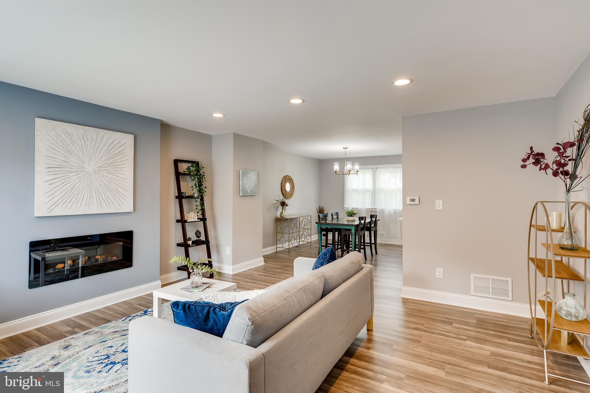 818 Reverdy Road Baltimore, MD 21212 - Photo 5 of 28 Living Room with remote fireplace