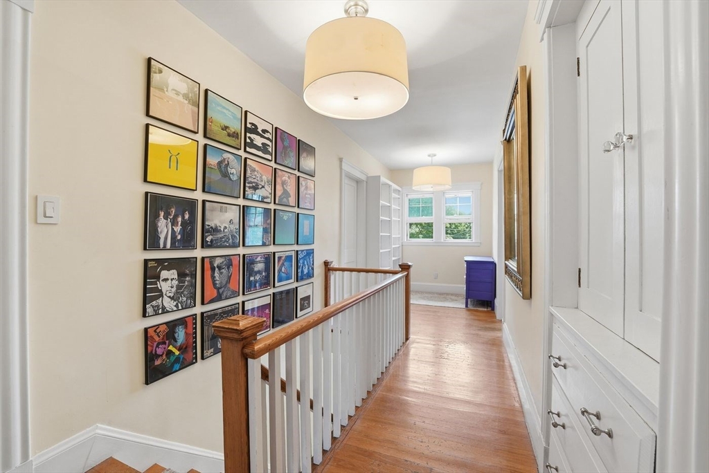 19 Humphrey Street Marblehead, MA 01945 - Photo 16 of 29 a view of a hallway to room and wooden floor