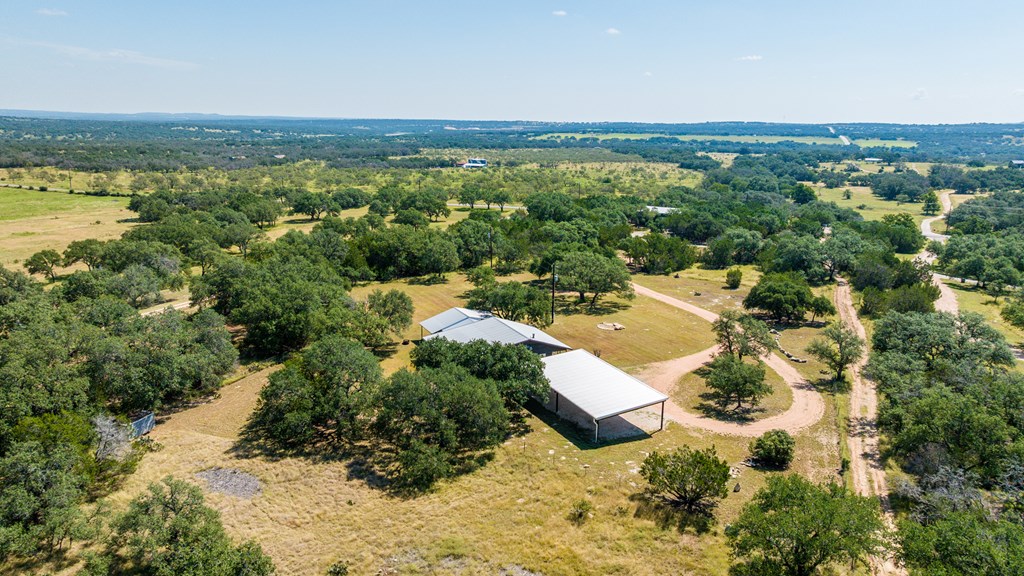 713 Ranch Road 1320 Hye, TX 78635 - Photo 3 of 26 an aerial view of residential houses with outdoor space and trees