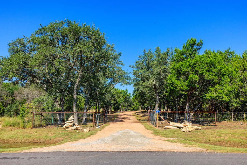 713 Ranch Road 1320 Hye, TX 78635 - Photo 4 of 26 a view of a swimming pool with an outdoor space and seating area