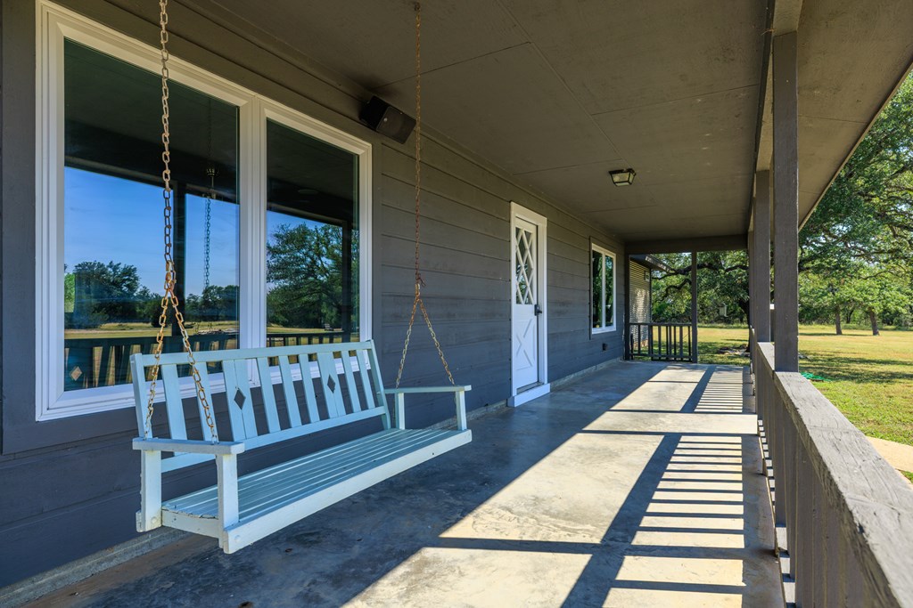 713 Ranch Road 1320 Hye, TX 78635 - Photo 6 of 26 a view of porch with a bench