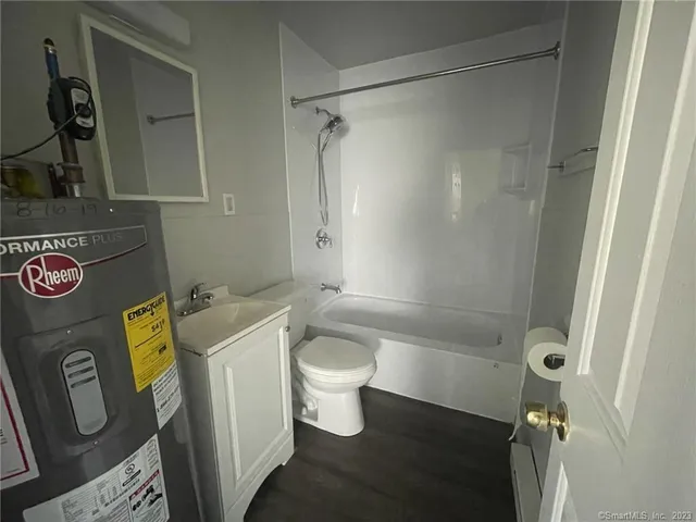 a bathroom with a shower and a toilet