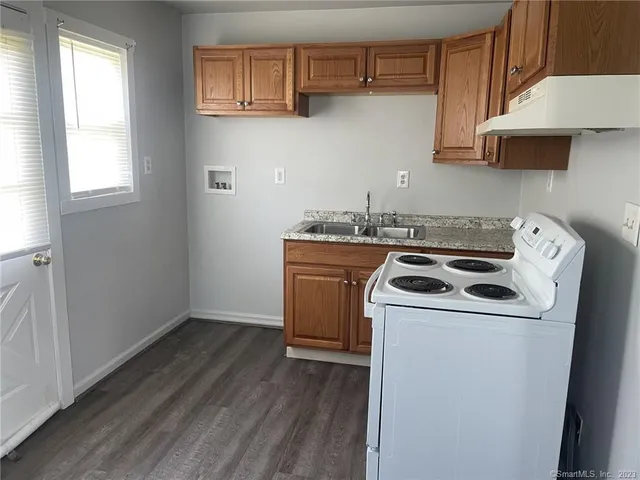 a view of a kitchen with washer and dryer