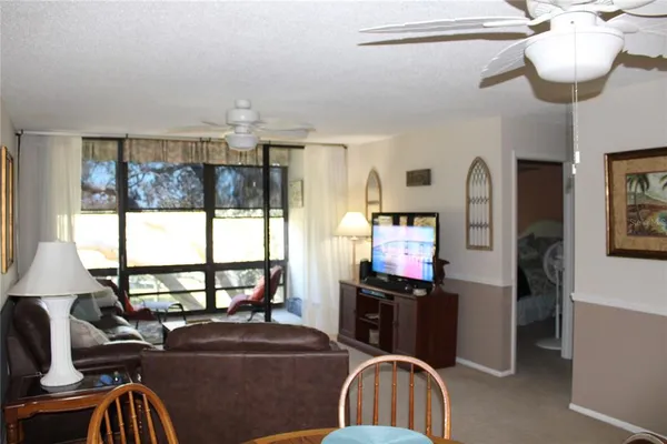 a view of a livingroom with furniture and windows
