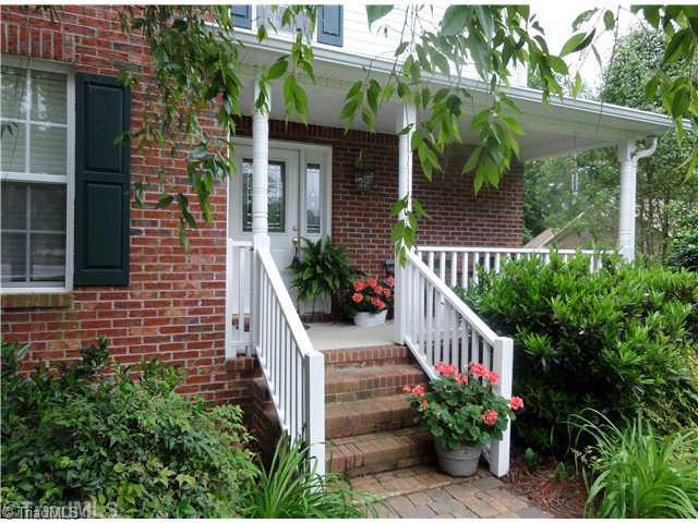 411 Walnut Grove Road Archdale, NC 27263 - Photo 3 of 16 Exterior Front. covered front porch with space for seating